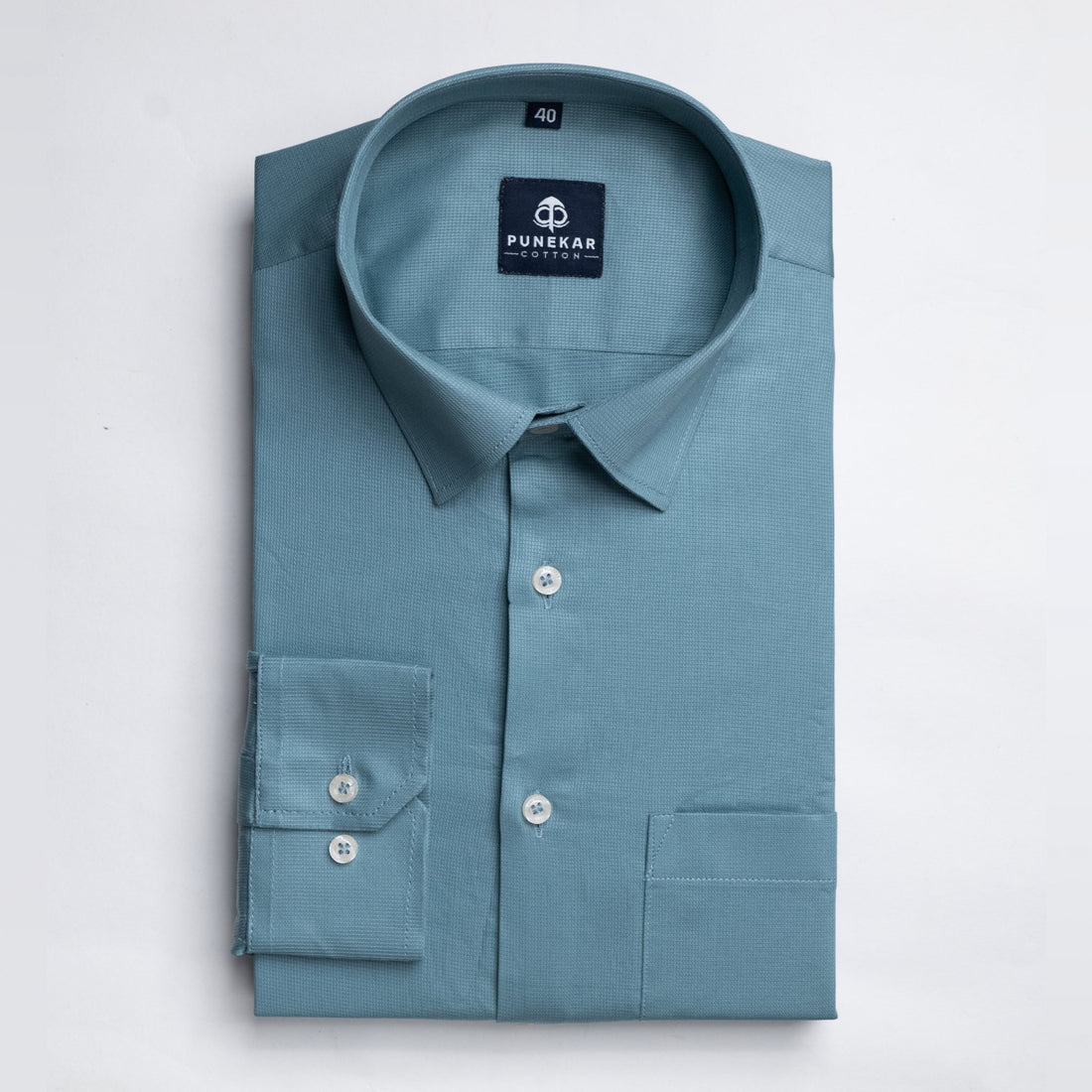 https://www.punekarcotton.com/cdn/shop/products/peacock-blue-color-micro-checks-texture-satin-cotton-shirt-for-men-847695.jpg?v=1696703380&width=1100